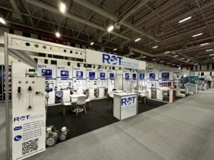 Professional trade show booth display with large-format panels showcasing precision measurement technology solutions